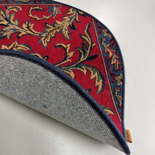 Vintage tapijt warme rood/roze, donkerblauw, oker van kleur