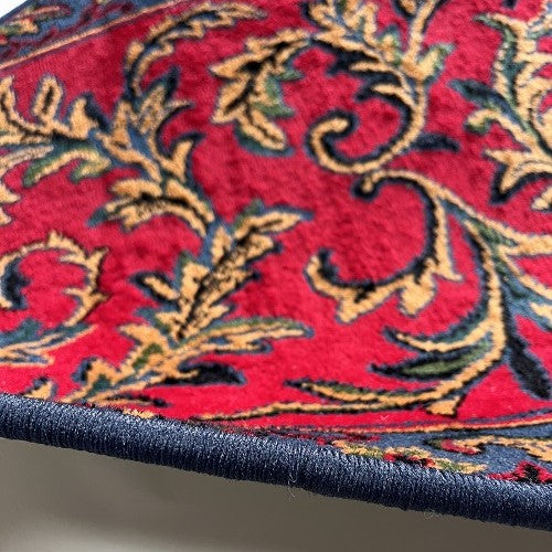 Vintage tapijt warme rood/roze, donkerblauw, oker van kleur